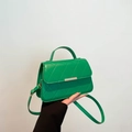 Bright green quilted leather handbag with gold metal clasp and top handle for women - Green
