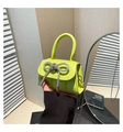 Detail of neon green mini bag with sparkling rhinestone bow and silver chain strap - Green