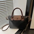 Bolso tote bicolor negro y marrón en cuero texturizado con dos asas superiores - Negro
