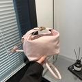 Light pink leather handbag with irregular stitching and gold metal buckle - Pink