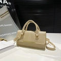 Beige textured top handle handbag with gold hardware and adjustable shoulder strap - Khaki
