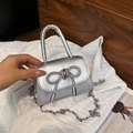 Chic silver mini handbag featuring a sparkling rhinestone bow and stylish chain strap - Silver