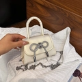 Mini cream satin handbag with sparkling rhinestone bow and silver chain strap - Gold