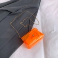 Mini transparent jelly shoulder bag in bright orange with golden chain and clasp - Orange