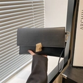 Elegant black minimalist envelope clutch with horizontal texture and gold buckle - Black