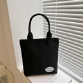 Bolso tote minimalista de pana negra con rayas verticales y asas superiores dobles - Negro
