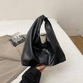 Minimalist black pleated cloud bag with a unique knot handle design in soft faux leather - Black