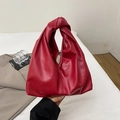 Bright red pleated cloud handbag featuring a unique knotted handle in soft vegan leather - Red