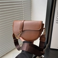 Vintage brown leather saddle bag with wide nylon strap and decorative gold chain - Brown