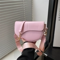 Pink leather saddle bag with wide shoulder strap and metal chain detail for women - Pink