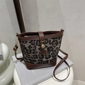 Retro leopard print bucket bag with brown leather trim and golden twist lock closure - Gray