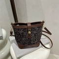 Leopard print bucket bag with brown leather trim and golden twist lock detail - Black