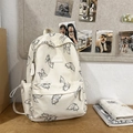 Mochila crema con estampado de mariposas de nailon y amplios bolsillos con cremallera - Blanco