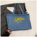 Détail du sac cabas en denim bleu avec broderie jaune Groovy Trippy Heart - Bleu clair
