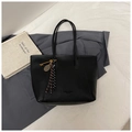 Detail of black pebbled leather tote bag with woven tassels and golden key charms - No Pendant / Black