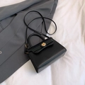 Minimalist black PU leather trapezoid handbag with gold rotating lock and strap - Black