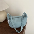 Light blue corduroy hobo bag with adjustable strap and a cute puppy pendant - Green