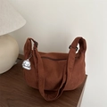 Brown corduroy hobo shoulder bag with a crescent shape and cute dog charm accent - Brown