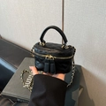 Detail of black quilted leather mini box bag with chain strap and double zipper closure - Black