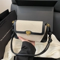 Chic canvas and black leather patchwork shoulder bag with vintage gold metal lock - Black
