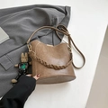 Brown bucket bag in lychee texture faux leather with woven handle and rabbit charm - No Pendant / Tan