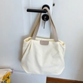 Minimalist off-white corduroy tote bag with brown PU straps and leather patch detail - Off White