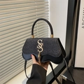 Chic black glitter crossbody bag with gold SSS logo and unique wave-curved base - Black