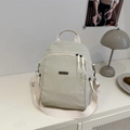 Minimalist beige lightweight nylon backpack with JINGPIN metal logo for daily travel - White