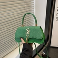 Green glitter leather handbag with golden metal logo and fringe tassel accessory - Green