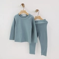 Kids long sleeve pajama set in greyish blue cotton hung on a wooden hanger on white wall - Light Blue / 110cm