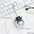 Disco ball keychain with black mini cowboy hat and silver lobster clasp accessory - Black