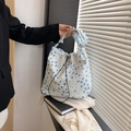 Floral nylon shoulder bag in white and blue featuring a textured bubble fabric finish - Blue