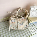 Floral print small pleated handbag with orange flower pattern and decorative ribbons - Yellow