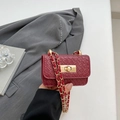 Red woven mini crossbody bag with gold chain strap and metal turn-lock closure - Red