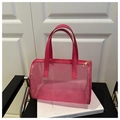 Detail der pinkfarbenen Netztasche mit goldenem Reißverschluss und Ledergriff - Rosa