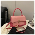 Detail of rose pink square handbag featuring fabric splicing and U-shaped gold metal buckle - Rose Red