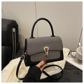 Detail of grey twill and black leather mini handbag with gold horsehair buckle - Black