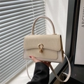 Beige textured patchwork handbag with golden U-shaped buckle and crossbody strap - Off White