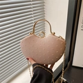 Elegant dusty pink crossbody bag with ring handle and rhinestone clasp detail - Pink