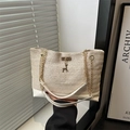 Off-white straw woven tote bag with gold chain straps and a small deer pendant charm - White