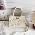 Creamy white leather crossbody bag with elegant bows, pearls, and a top handle - Off White