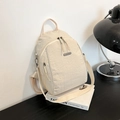Minimalist beige crinkled nylon backpack for women featuring JING PIN metal hardware - White