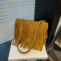 Mustard yellow bohemian suede tassel crossbody bag with adjustable shoulder strap - Brown