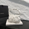 White pleated handbag with large organza bow detail and metallic chain strap - White