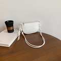 White crescent crossbody bag with litchi texture and stylish knotted shoulder strap - White