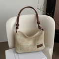 Borsa tote in paglia intrecciata beige con manici in pelle marrone e nodo decorativo - Marrone