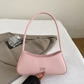 Pink minimalist faux leather half-moon underarm bag with silver metal bow accessory - Nude Pink