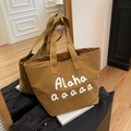 Brown canvas tote bag with white Alaha lettering and spacious interior for daily use - Brown