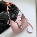 Pink crescent shoulder bag with a silver bow decoration and adjustable strap - Pink
