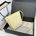 Beige woven leather crossbody bucket bag in premium gift box packaging for summer style - Yellow